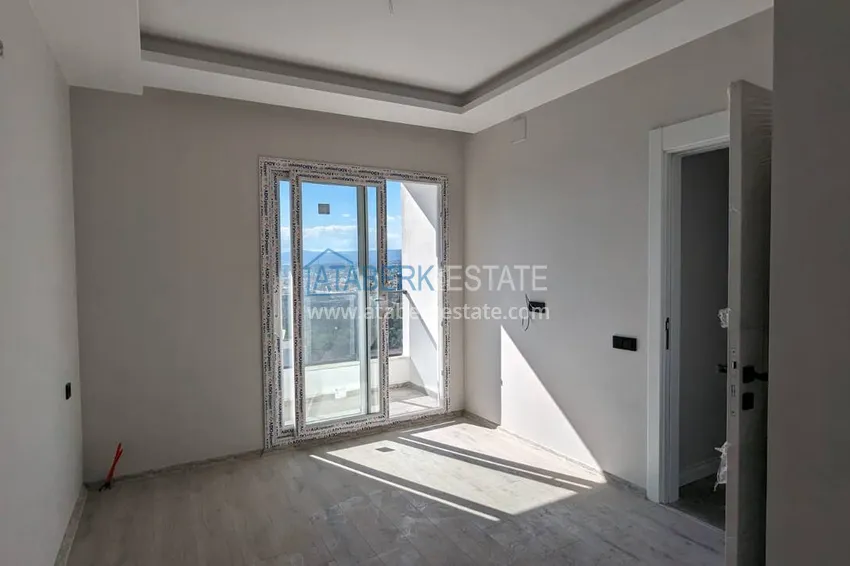 Kupuj  Apartament z jedną sypialnią z pięknym wykończeniem i widokiem na góry w dzielnicy Tomyuk, Mersin. Rata jest możliwa 9 