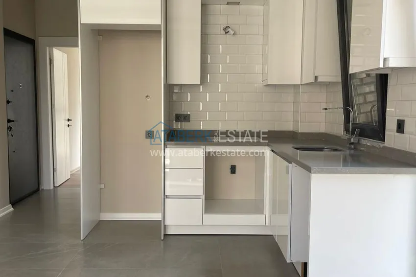Kupuj  Apartament 1+1 w centrum Alanyi w nowym nowoczesnym kompleksie - plaża Kleopatra 13 