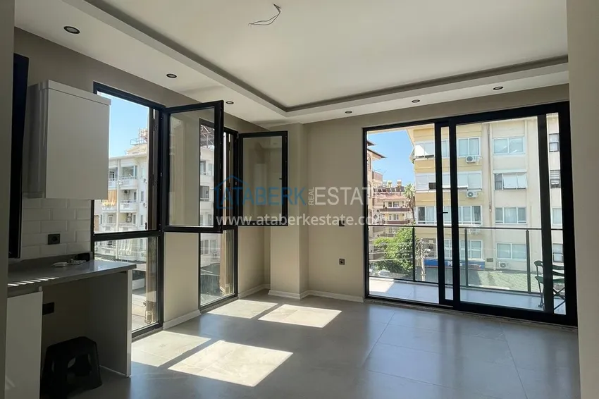 Kupuj  Apartament 1+1 w centrum Alanyi w nowym nowoczesnym kompleksie - plaża Kleopatra 3 