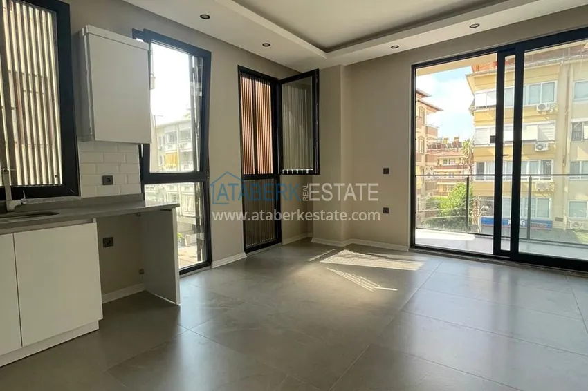 Kupuj  Apartament 1+1 w centrum Alanyi w nowym nowoczesnym kompleksie - plaża Kleopatra 10 