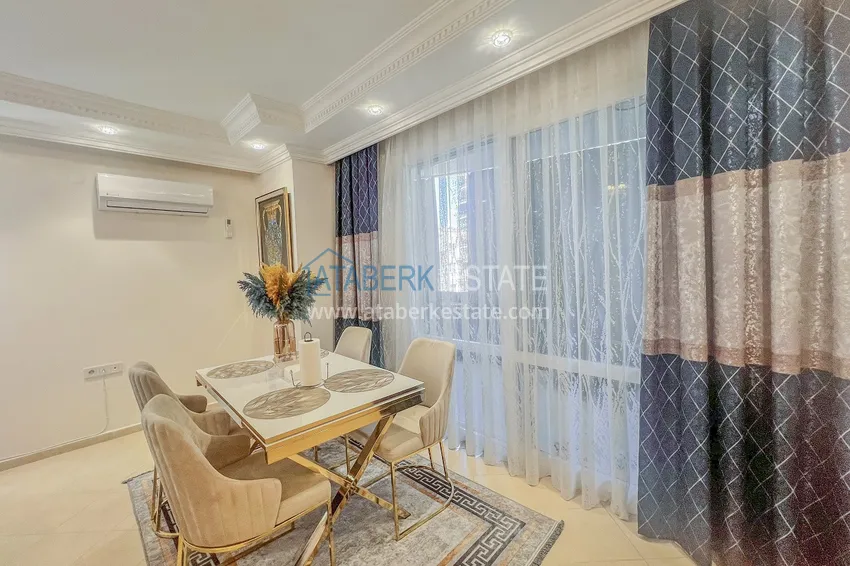 Kupuj  Apartament z dwiema sypialniami z nowymi meblami i przeszklonym balkonem w Mahmutlar 10 