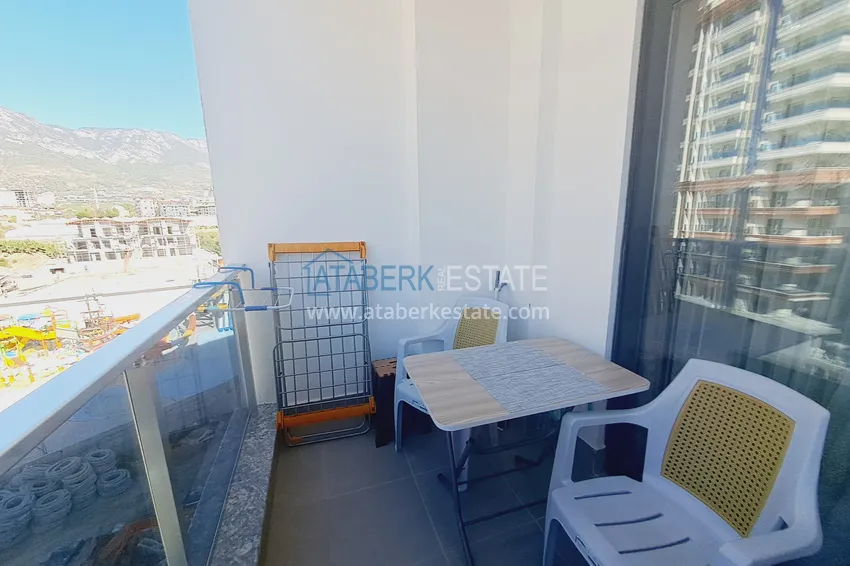 Kupuj  Apartament 1+1 z meblami i widokiem na góry w kompleksie z infrastrukturą hotelową, dzielnica Mahmutlar — Alanya  11 