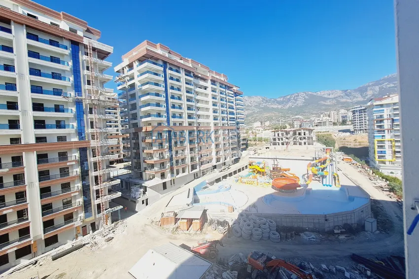 Kupuj  Apartament 1+1 z meblami i widokiem na góry w kompleksie z infrastrukturą hotelową, dzielnica Mahmutlar — Alanya  12 