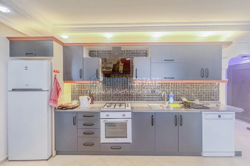 Kupuj  Apartament z dwiema sypialniami z nowymi meblami i przeszklonym balkonem w Mahmutlar 12 