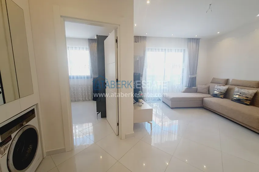 Kupuj  Apartament 1+1 z meblami i widokiem na góry w kompleksie z infrastrukturą hotelową, dzielnica Mahmutlar — Alanya  1 