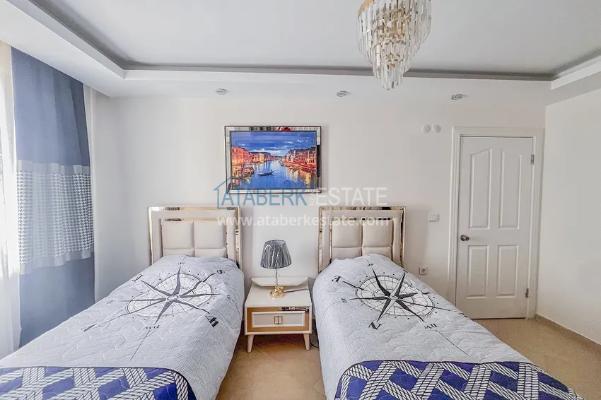 Kupuj  Apartament z dwiema sypialniami z nowymi meblami i przeszklonym balkonem w Mahmutlar 20 