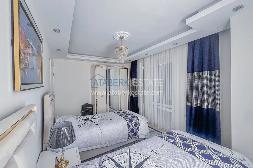 Kupuj  Apartament z dwiema sypialniami z nowymi meblami i przeszklonym balkonem w Mahmutlar 21 
