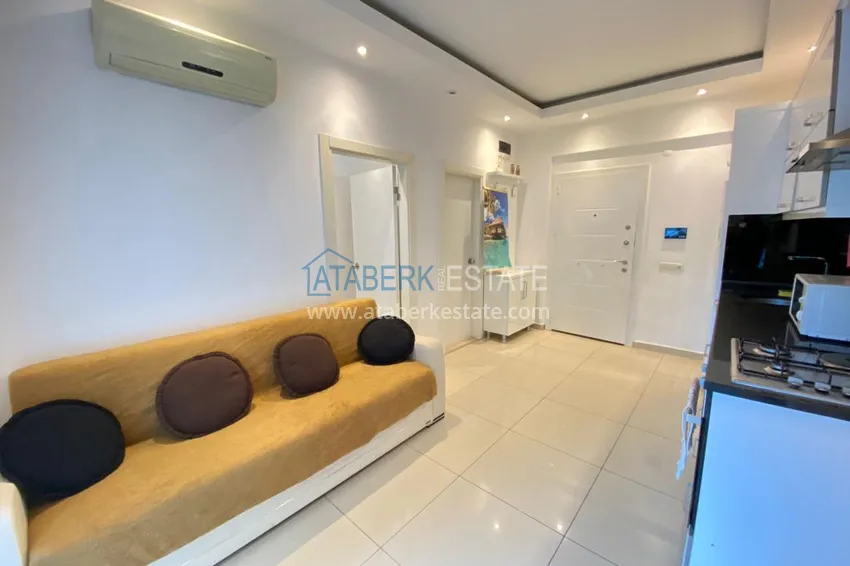 Kupuj  Apartament 1+1 z meblami i przeszklonym balkonem w centrum Alanyi — Plaża Kleopatra 2 