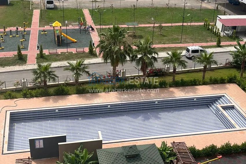 Kupuj  Stylowy apartament z 2 sypialniami i widokiem na góry w centrum Teje, Mersin 10 