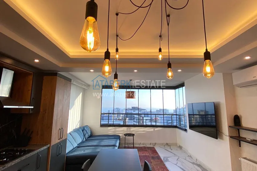 Kupuj  Umeblowany apartament z 2 sypialniami i panoramicznym widokiem na morze w dzielnicy Soli, Mersin 1 