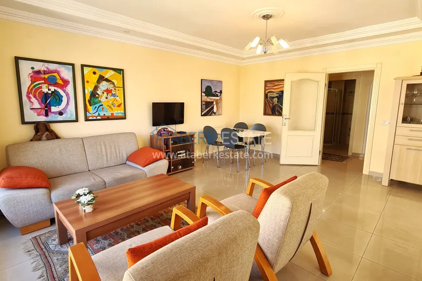 Kupuj  Apartament 2+1 z meblami i przeszklonym balkonem zaledwie 300 metrów od morza, dzielnica Oba - Alanya 1 