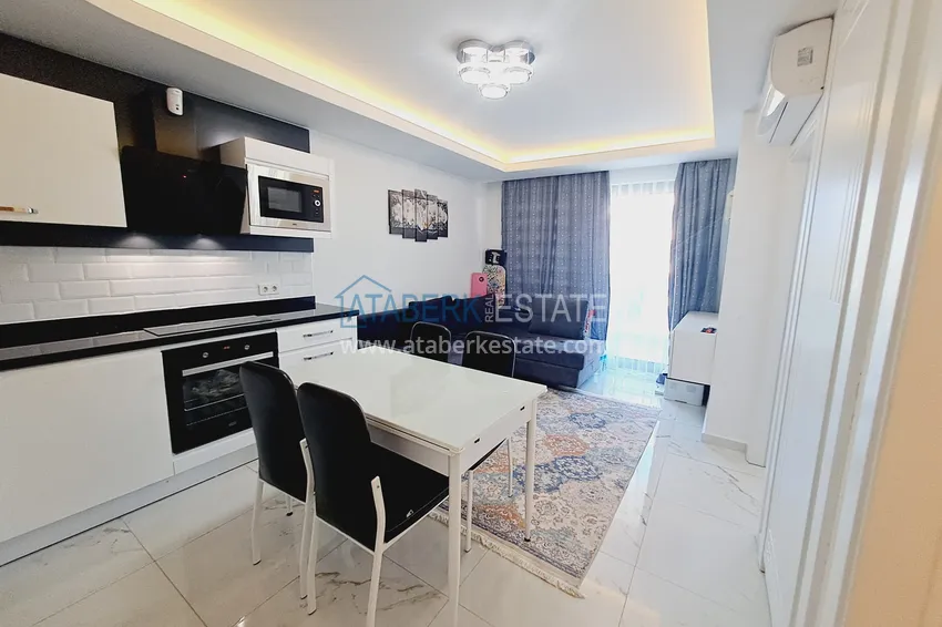 Kupuj  Apartament z jedną sypialnią w centrum Alanyi z meblami i dostępem do prywatnej plaży 1 