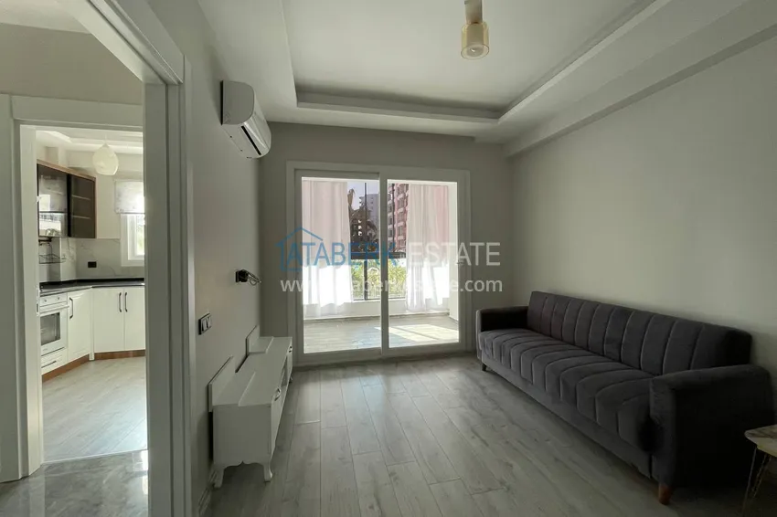 Kupuj  Jednopokojowy apartament z nowymi meblami, oddzielną kuchnią i 2 balkonami w Mersin, Tomyuk  4 