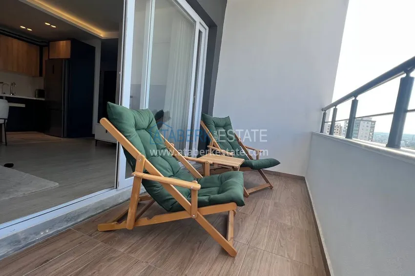 Kupuj  Stylowy apartament z 2 sypialniami i widokiem na góry w centrum Teje, Mersin 9 
