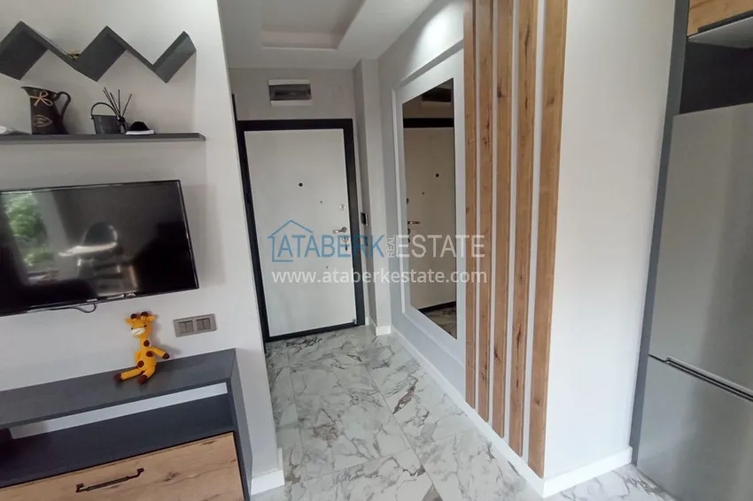 Kupuj  Apartament z jedną sypialnią pod klucz z przeszklonym balkonem od właściciela w centrum Mezitli 1 