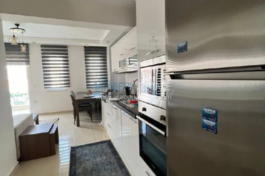Kupuj  Umeblowany apartament z widokiem na góry w centrum Alanyi, w pobliżu plaży Kleopatra. Nieruchomość na zezwolenie na pobyt 4 