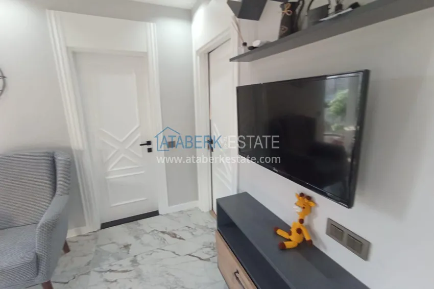 Kupuj  Apartament z jedną sypialnią pod klucz z przeszklonym balkonem od właściciela w centrum Mezitli 4 