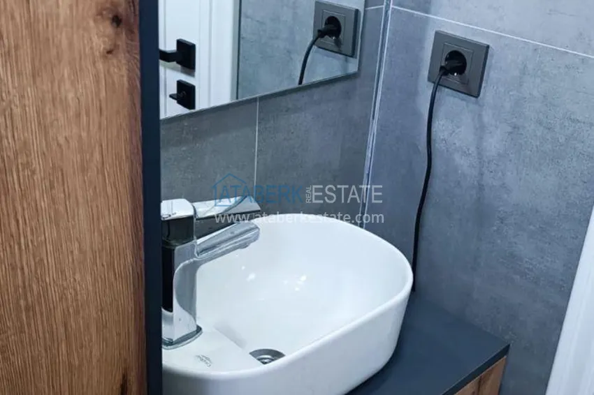 Kupuj  Apartament z jedną sypialnią pod klucz z przeszklonym balkonem od właściciela w centrum Mezitli 8 