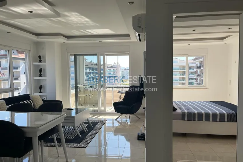 Kupuj  Przytulny apartament z jedną sypialnią na samym wybrzeżu Morza Śródziemnego, tylko 100 metrów — dzielnica Kestel, Alanya 1 