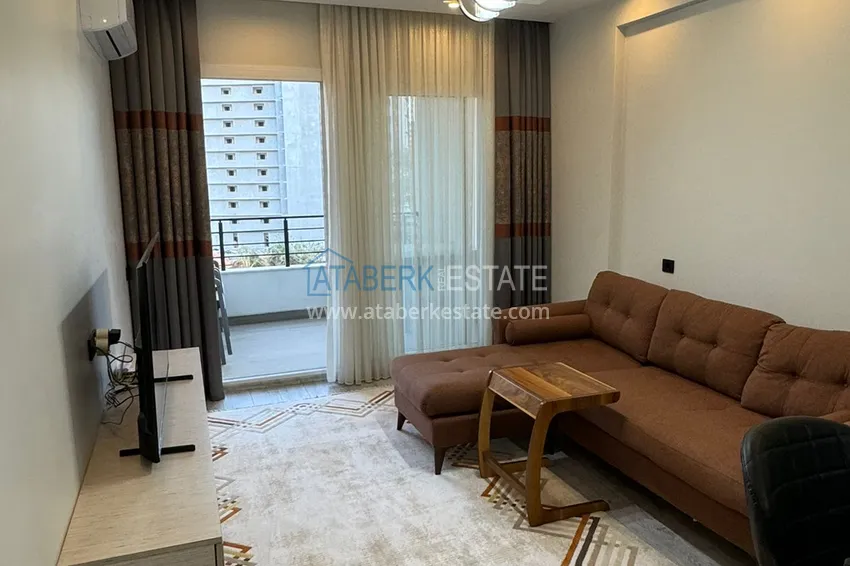 Kupuj  Jednopokojowy apartament z meblami w zadbanym kompleksie — Mersin, dzielnica Tomyuk 2 