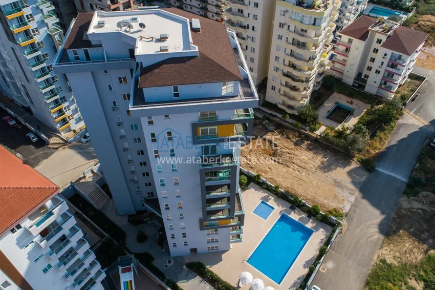 Apartament 1+1 w Mahmutlar, pod klucz z przeszklonym balkonem w nowoczesnym kompleksie 3 