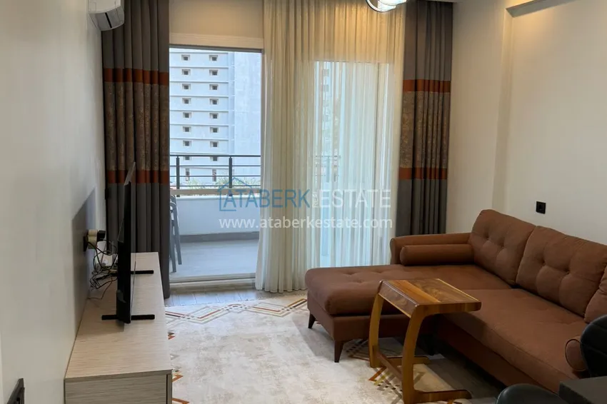 Kupuj  Jednopokojowy apartament z meblami w zadbanym kompleksie — Mersin, dzielnica Tomyuk 3 