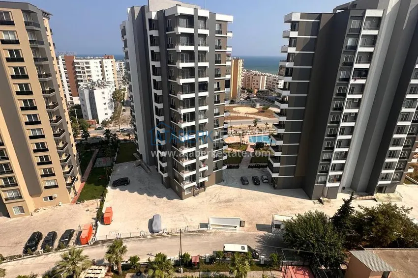 Kupuj  Umeblowane mieszkanie z jedną sypialnią w nowym kompleksie mieszkalnym, dzielnica Tomyuk, Mersin 6 
