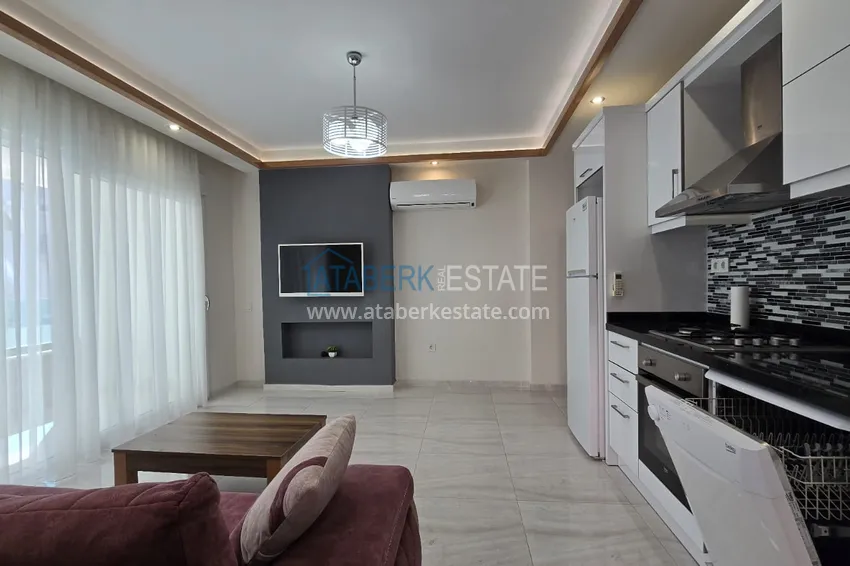 Kupuj  Jednopokojowy apartament z meblami w centrum Alanyi. Nieruchomości z zezwoleniem na pobyt 8 