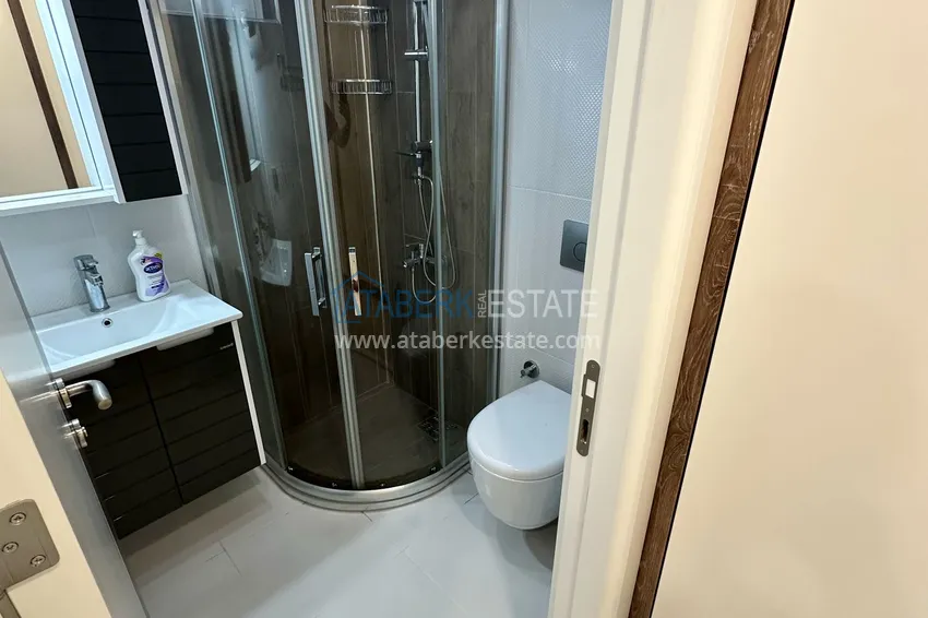 Kupuj  Dwupokojowy apartament z meblami i przeszklonymi balkonami w Konyaalti, Liman - 600 m do plaży 11 