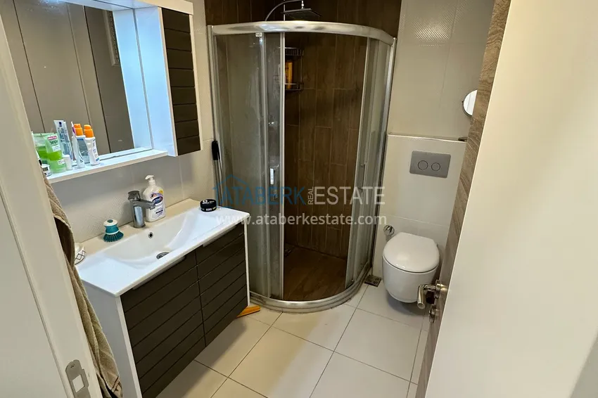Kupuj  Dwupokojowy apartament z meblami i przeszklonymi balkonami w Konyaalti, Liman - 600 m do plaży 12 