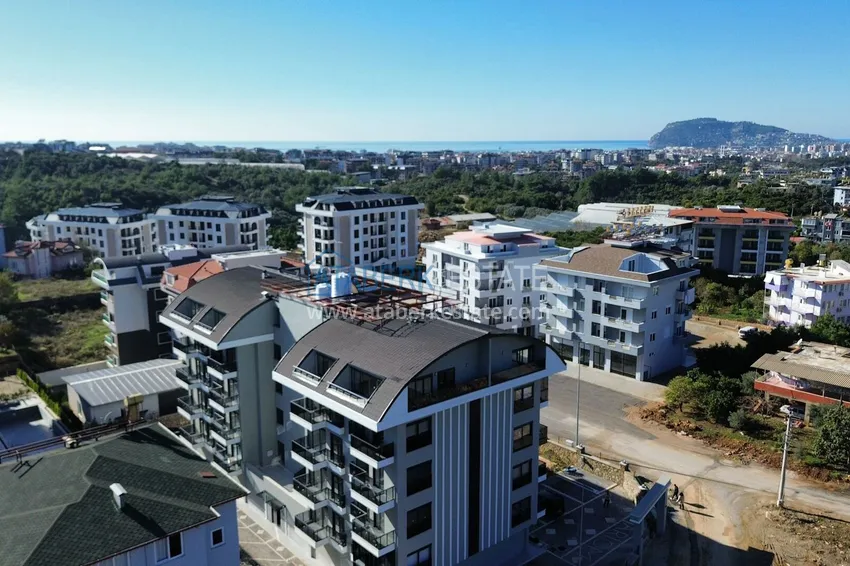 Apartament 1+1 z nowymi meblami i przeszklonym balkonem w nowym budynku — Alanya, dzielnica Górna Oba 1 