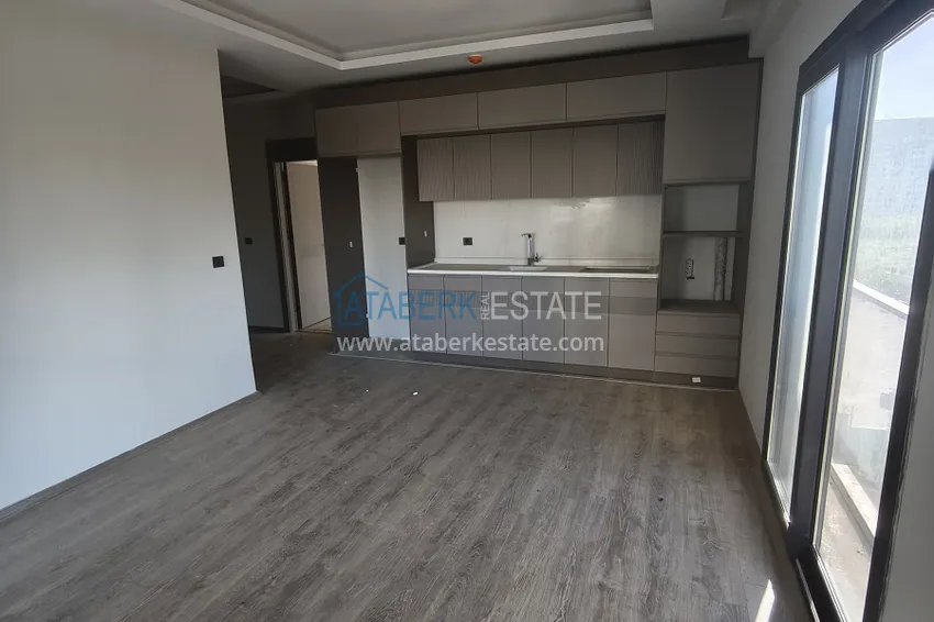 Kupuj  Apartament 1+1 z wysokiej jakości wykończeniem — Mersin, dzielnica Arpachbakhshish 6 