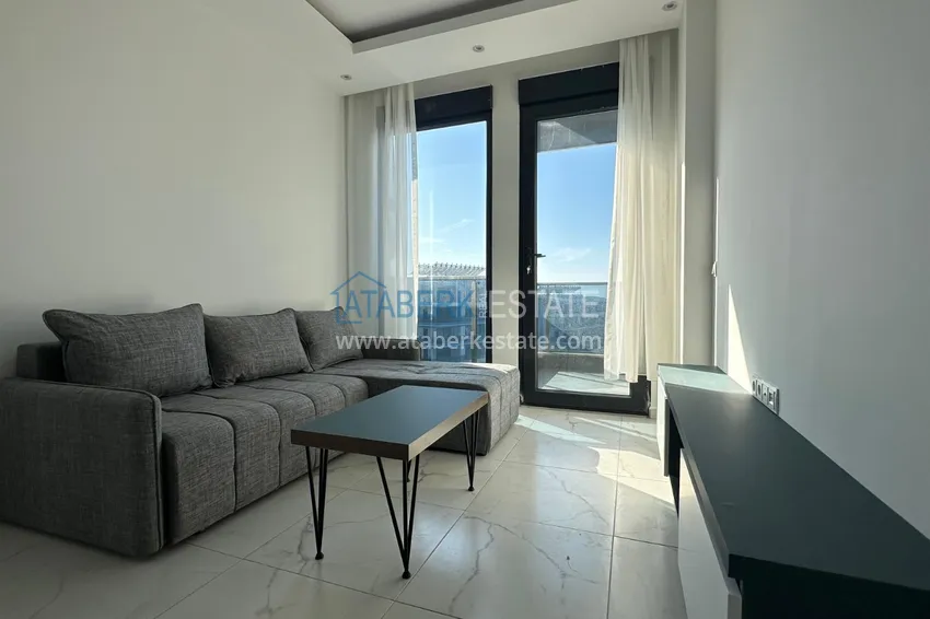 Kupuj  Apartament z widokiem na morze i nowymi meblami w rodzinnym kompleksie — Kargicak, Alanya 2 