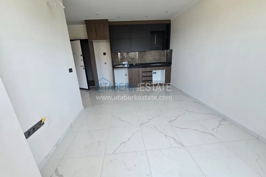 Kupuj  Apartament 1+1 z pięknym wykończeniem w nowoczesnym kompleksie - dzielnica Mahmutlar, Alanya 1 
