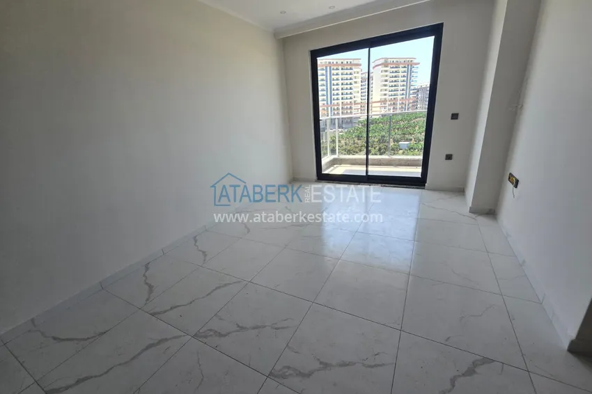 Kupuj  Apartament 1+1 z pięknym wykończeniem w nowoczesnym kompleksie - dzielnica Mahmutlar, Alanya 4 