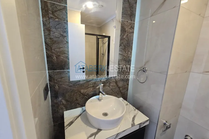 Kupuj  Apartament 1+1 z pięknym wykończeniem w nowoczesnym kompleksie - dzielnica Mahmutlar, Alanya 9 
