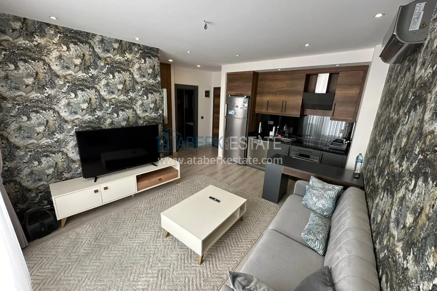 Kupuj Umeblowany apartament z jedną sypialnią w kompleksie z infrastrukturą hotelową — Alanya, Mahmutlar 1