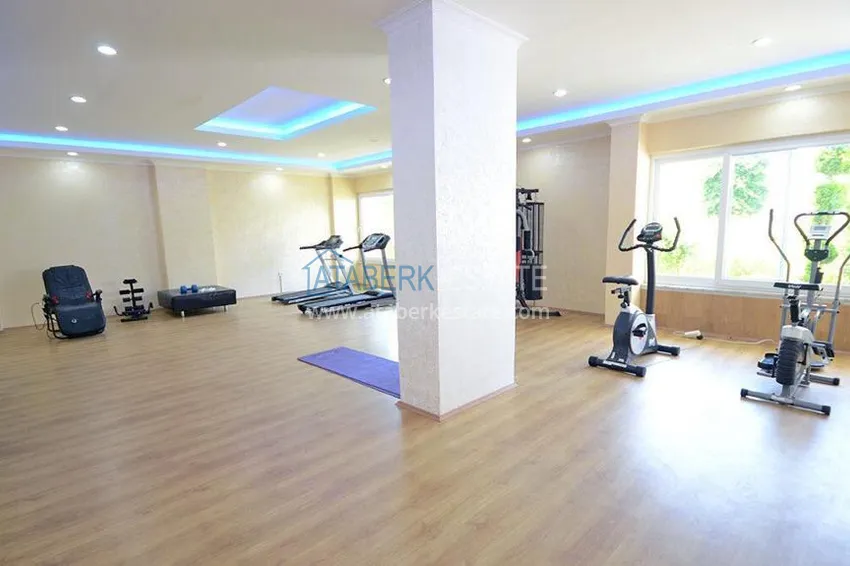 Rynek wtórny w Alanyi - apartament 1+1 z meblami i widokiem na góry, dzielnica Tosmur. Nadaje się do zezwolenia na pobyt 7 