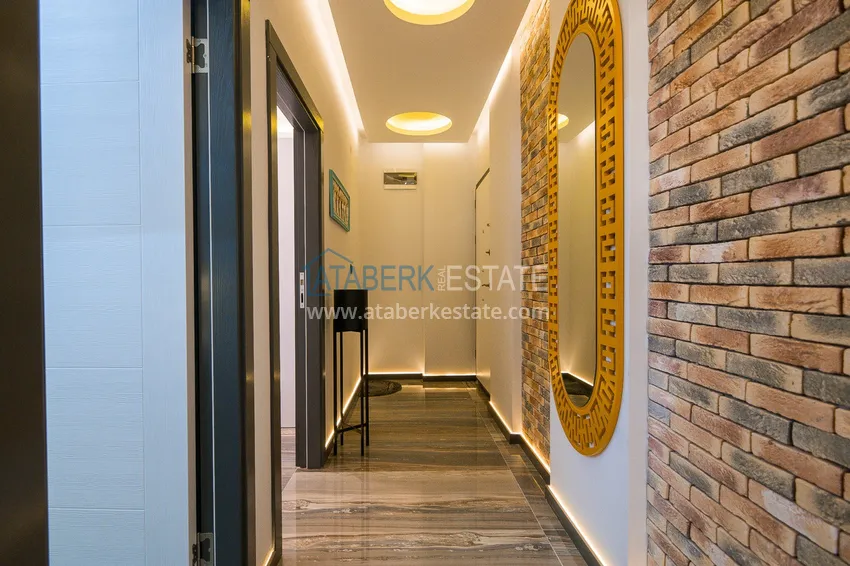 Kupuj  Gotowe mieszkanie w centrum Alanyi, na zezwolenie na pobyt — apartament z jedną sypialnią z meblami i widokiem na góry 2 
