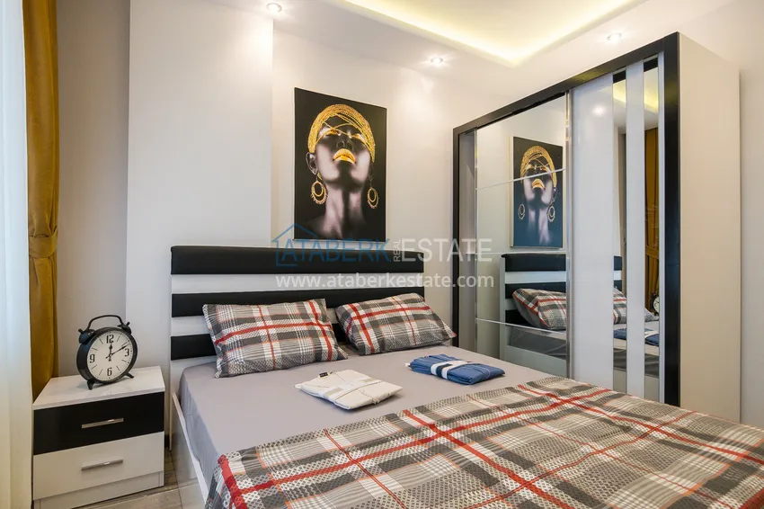 Kupuj  Gotowe mieszkanie w centrum Alanyi, na zezwolenie na pobyt — apartament z jedną sypialnią z meblami i widokiem na góry 11 
