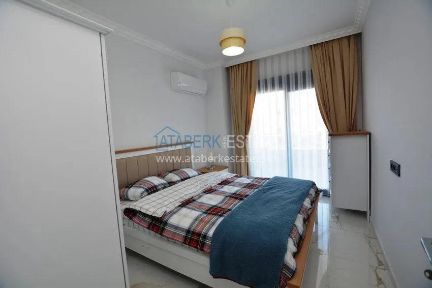 Kupuj  Apartament 2+1 z meblami i częściowym widokiem na morze w Mahmutlar — sprzedaż od właściciela 10 
