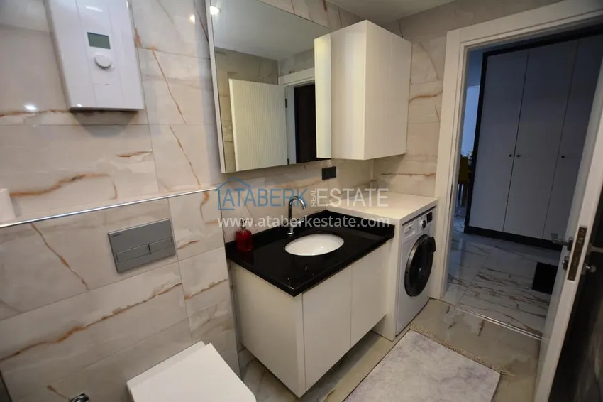 Kupuj  Apartament 2+1 z meblami i częściowym widokiem na morze w Mahmutlar — sprzedaż od właściciela 15 