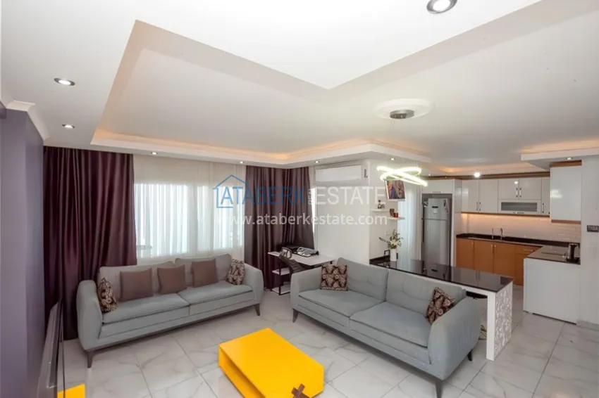 Kupuj  Dwupoziomowy penthouse 2+1 z meblami i widokiem na morze w centrum Mahmutlar 3 
