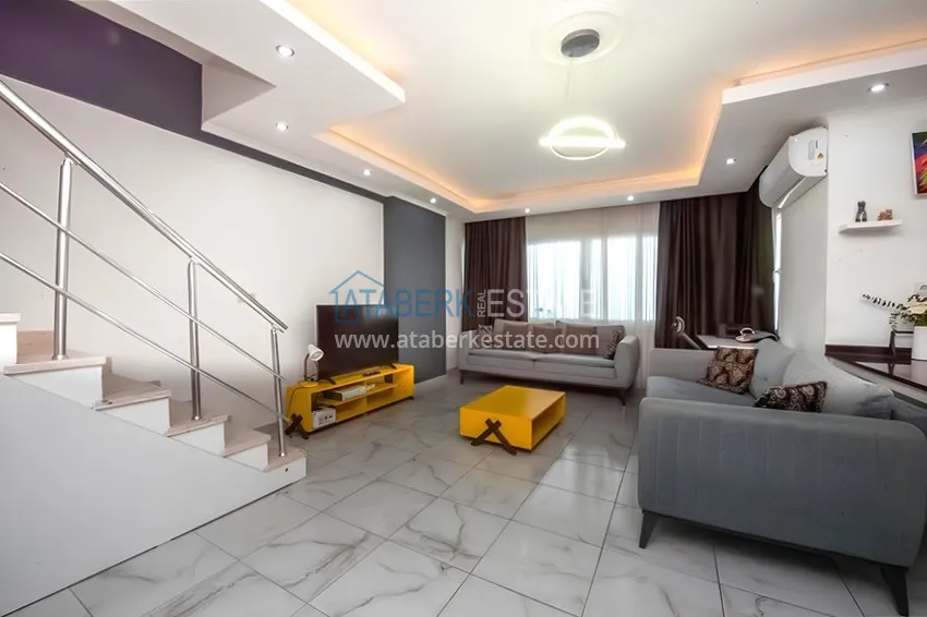 Kupuj  Dwupoziomowy penthouse 2+1 z meblami i widokiem na morze w centrum Mahmutlar 4 