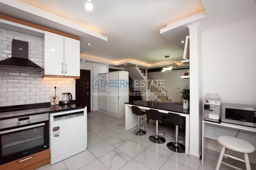 Kupuj  Dwupoziomowy penthouse 2+1 z meblami i widokiem na morze w centrum Mahmutlar 6 