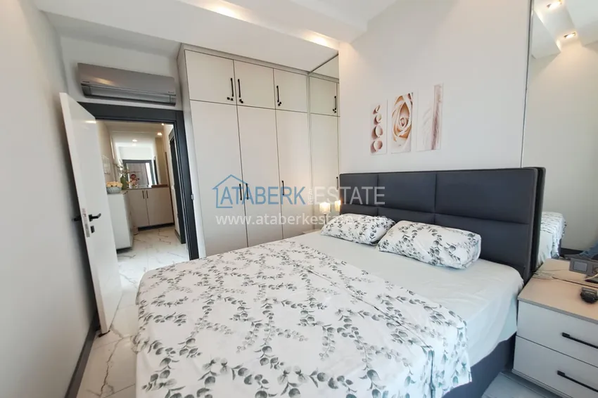 Kupuj  Apartament 2+1 z meblami, przeszklonym balkonem i widokiem na morze w centrum Mahmutlar, Alanya 12 