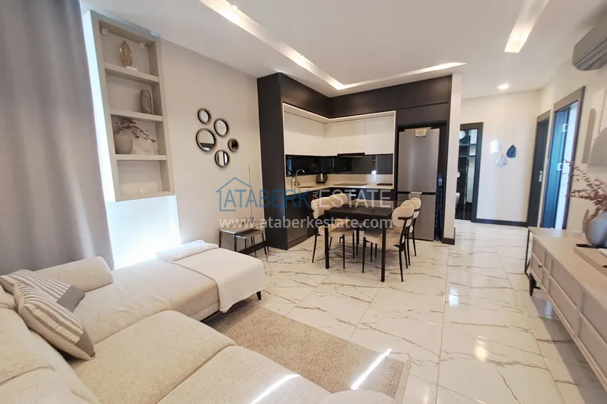 Kupuj  Apartament 2+1 z meblami, przeszklonym balkonem i widokiem na morze w centrum Mahmutlar, Alanya 4 