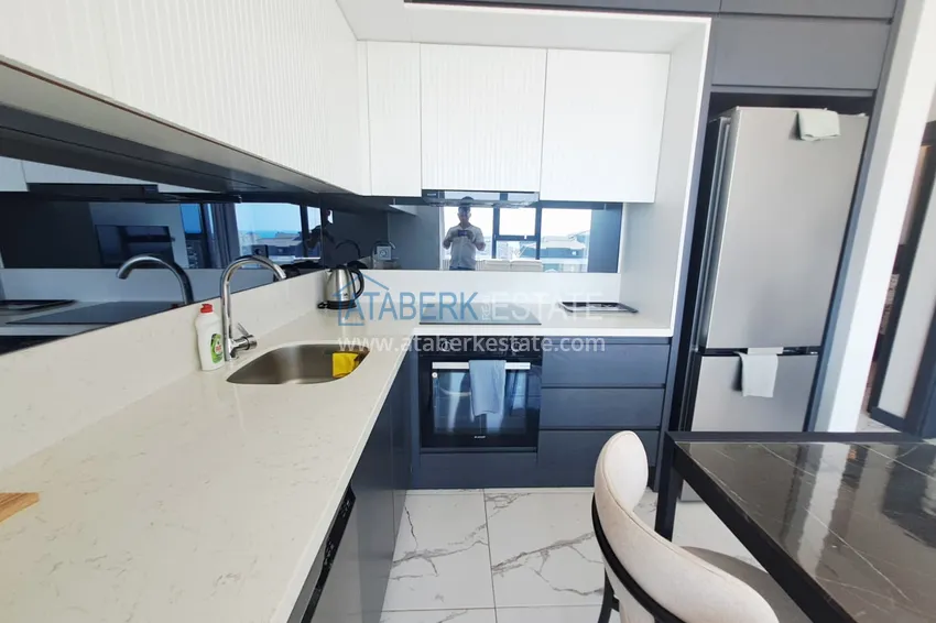Kupuj  Apartament 2+1 z meblami, przeszklonym balkonem i widokiem na morze w centrum Mahmutlar, Alanya 8 
