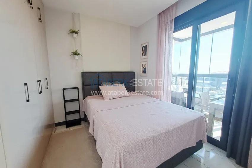 Kupuj  Apartament 2+1 z meblami, przeszklonym balkonem i widokiem na morze w centrum Mahmutlar, Alanya 9 