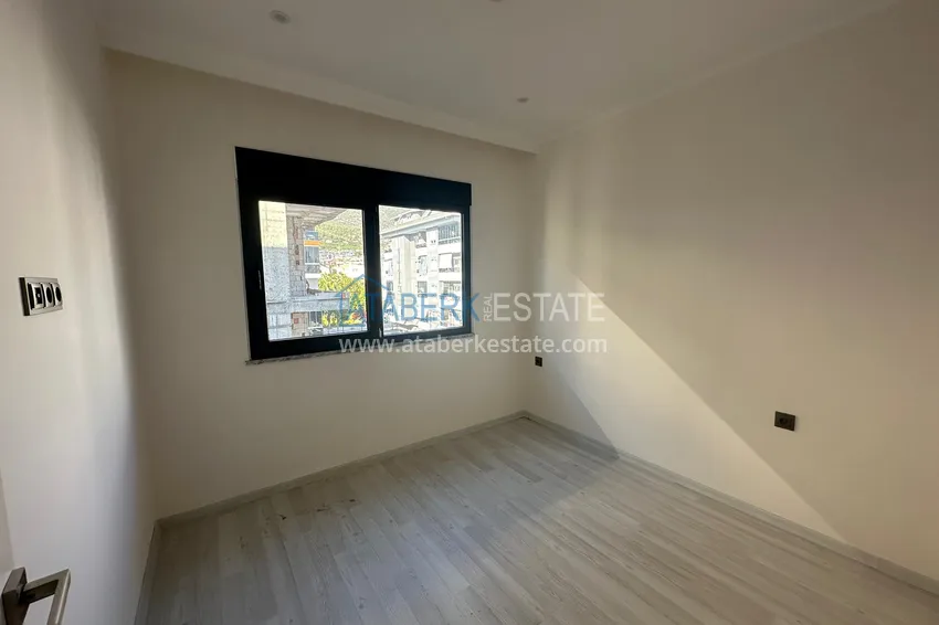 Kupuj  Apartament 2+1 w centrum Alanyi - z oddzielną kuchnią i widokiem na góry, odpowiedni na zezwolenie na pobyt 7 